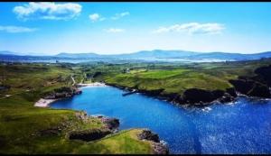 an aerial view of a river in a field at Private 1 bedroom suite in Cahersiveen