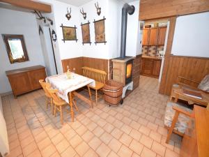 a kitchen with a table and a stove at Chalet in Malá Skála near Ski Slopes in Malá Skála