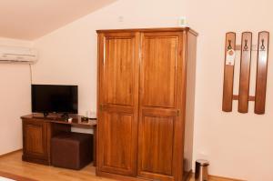 Et tv og/eller underholdning på Pensiunea Ingrid + 20 billeder