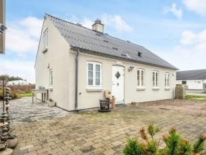 a white house with a slate roof at 6 person holiday home in Harboøre-By Traum in Harboør +27 photos