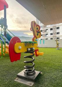 a playground with a toy gun on a playground at Casa Mira Towers Guadalupe Condo in Cebu City