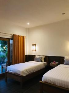 Postel nebo postele na pokoji v ubytování Dili gili