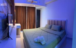 Katil atau katil-katil dalam bilik di Pollux Habibi Service Apartment