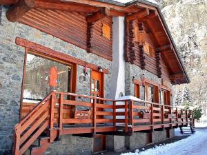 a building with a balcony on the side of it at Apartment in Antey-Saint-André near Ski Area in Antey-Saint-André