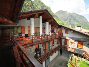 a balcony of a house with mountains in the background at Apartment in Antey-Saint-André near Ski Area in Antey-Saint-André +32 photos
