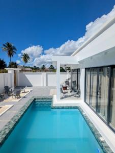 a swimming pool in the backyard of a house at Amour Beach Villas in Paje