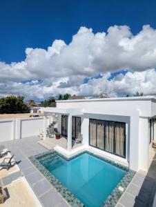 a swimming pool in the backyard of a house at Amour Beach Villas in Paje +74 photos