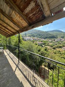 a balcony with a view of the mountains at Analipsi Village House in Análipsis +7 photos