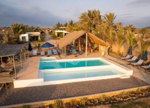 an image of a swimming pool at a resort at Toninas México Bungalow in Celestino Gasca