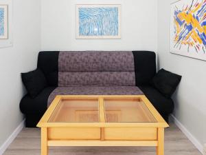 a couch in a living room with a coffee table at 6 person holiday home in Hadsund in Hadsund +36 photos