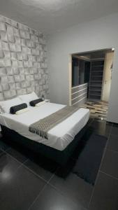 Ένα ή περισσότερα κρεβάτια σε δωμάτιο στο Casa de Inhô