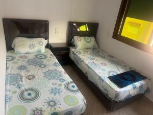 Postel nebo postele na pokoji v ubytování Apartamento familiar cerca del mar, Martil