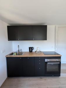 Dapur atau dapur kecil di Petite maison avec terrasse et vue imprenable