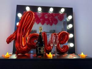 a table with a bottle of champagne and wine glasses at Mansa Halifax in Halifax
