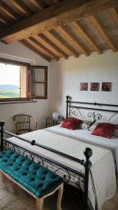 Ένα ή περισσότερα κρεβάτια σε δωμάτιο στο La Quercia