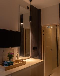 a bathroom with a sink and a large mirror at Moro Fuvahmulah in Fuvahmulah