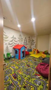 a childs room with a play area with a toy track at Arkhi Kokhta Bakuriani Apt 304 in Bakuriani