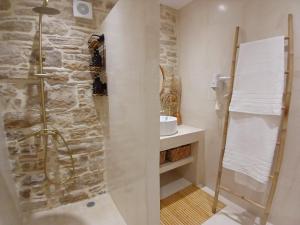 a bathroom with a shower and a sink at cozystudio Chezmoi in Chios