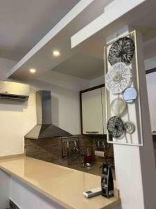 a kitchen with a sink and a counter top at Maya bay in Kotor +4 photos
