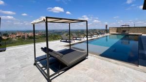 a swimming pool on the roof of a house at Villa Immersa Tra Le Vigne Con Piscina Riscaldata in Castiglione Tinella