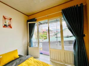 Ένα ή περισσότερα κρεβάτια σε δωμάτιο στο Homestay Hello 24h +6 φωτογραφίες