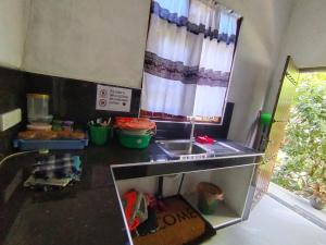 a kitchen with a sink and a counter top at Family Home Unawatuna in Unawatuna +5 photos