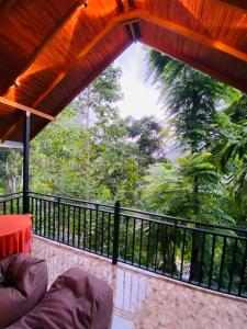 a balcony with a view of a forest at Nice view in Ella +36 photos
