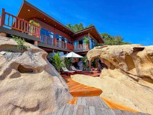 a large house with a large rock at Sao Biển Cam Ranh - Starfish Cam Ranh in Cam Ranh