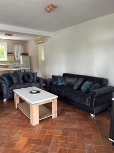 a living room with a couch and a coffee table at Villa Ela in Prijedor