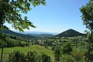 a view of a valley with mountains in the distance at Les Estables Belle maison typique du Mezenc in Les Estables