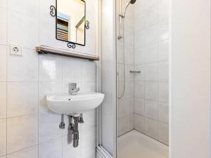 a bathroom with a sink and a shower at Apartment Uttendorf near Ski Slopes in Uttendorf +24 photos