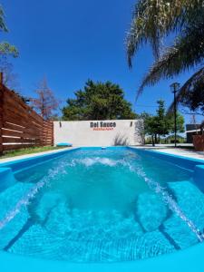 a swimming pool with water coming out of it at Mini Suite en Cabañas del Sauce in Parana