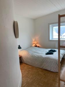 a bedroom with a bed and a window at Dunes & Vagues, appartement avec balcon vue mer in Fort-Mahon-Plage +36 photos