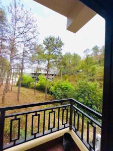 a view from the balcony of a house at XTSY Economy Dorms & Rooms in Shillong
