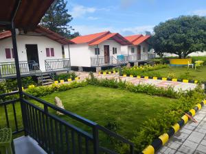 a view of a house with a garden at Kurinjchi Garden Resort - Yelagiri Hills in Yelagiri