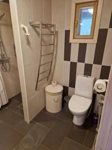 a bathroom with a toilet and a window at Heart of silence 