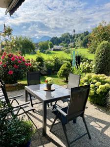 a table and chairs sitting on a patio at SUP CoTtAgE gArDeN in Sankt Jakob im Rosental +15 photos