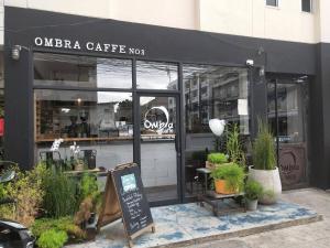 a coffee shop with a sign in front of it at 2 Bedrooms 1 living room near Old City in Chiang Mai