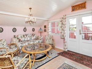 a living room with a couch and a table at 4 person holiday home in Thisted in Thisted