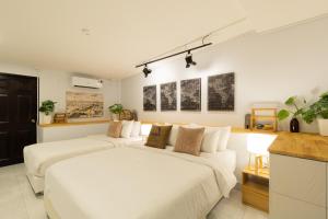 Ένα ή περισσότερα κρεβάτια σε δωμάτιο στο Ombra House No26