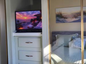 a tv sitting on top of a dresser at Cozy, Private Guest House #5 in Blaine