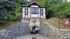 a group of people standing in front of a building at Apartman19 Resavica in Železnička Stanica Resavica