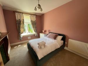 Postel nebo postele na pokoji v ubytování The Manse