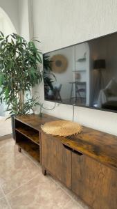a room with a large mirror and a wooden table at Atlantico Flamingo in Calpe