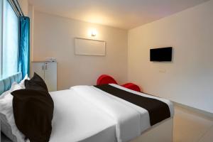 Katil atau katil-katil dalam bilik di FabHotel Seven Elite