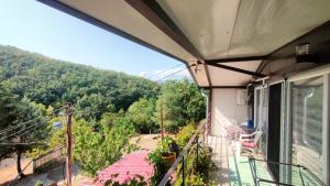 a balcony with a view of a mountain at Krčma u Planini in Bojnik