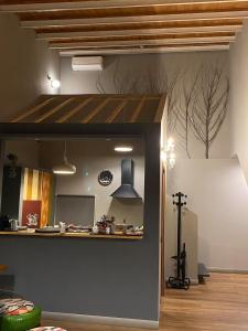 a kitchen with a counter in the middle of a room at Studio O F 2 in Leonforte