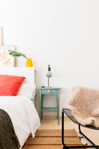 a bedroom with a bed and a side table at Profithome-Punta Larga in Candelaria +32 photos