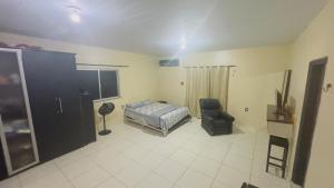 Ένα ή περισσότερα κρεβάτια σε δωμάτιο στο Casa Boaventura COP 30