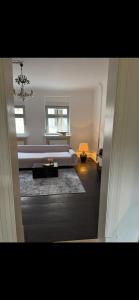 a large bedroom with a bed and a table at Südfrankreich bei Berlin in Werder